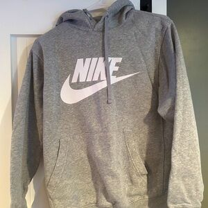 Nike men’s hoodie size small color is gray Nike logo across the front